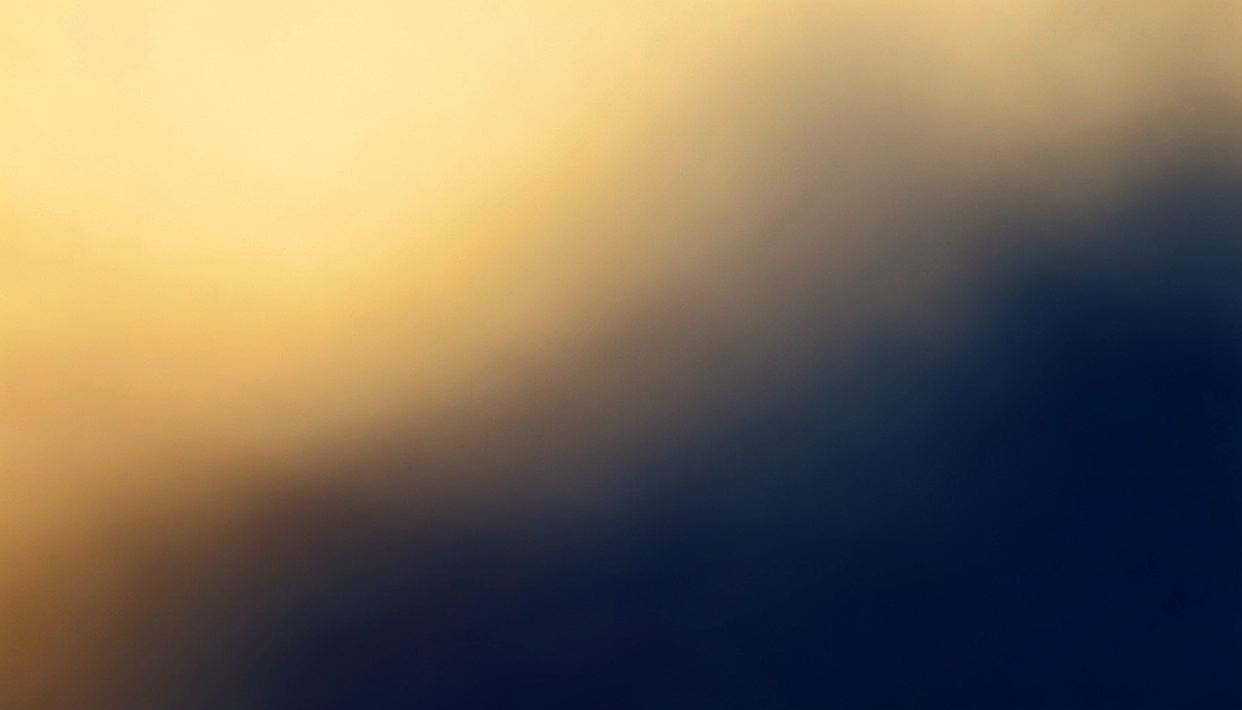 Soft abstract gradient in warm gold and deep navy tones, calm and uplifting mood